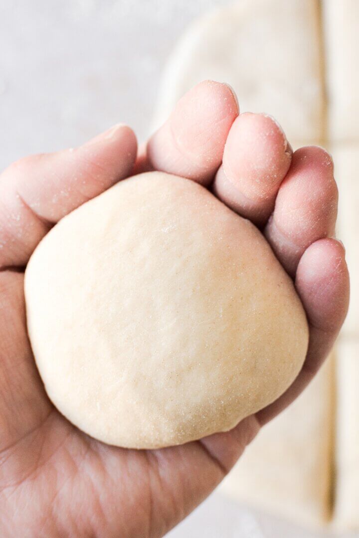 Bread dough shaped into a bun.