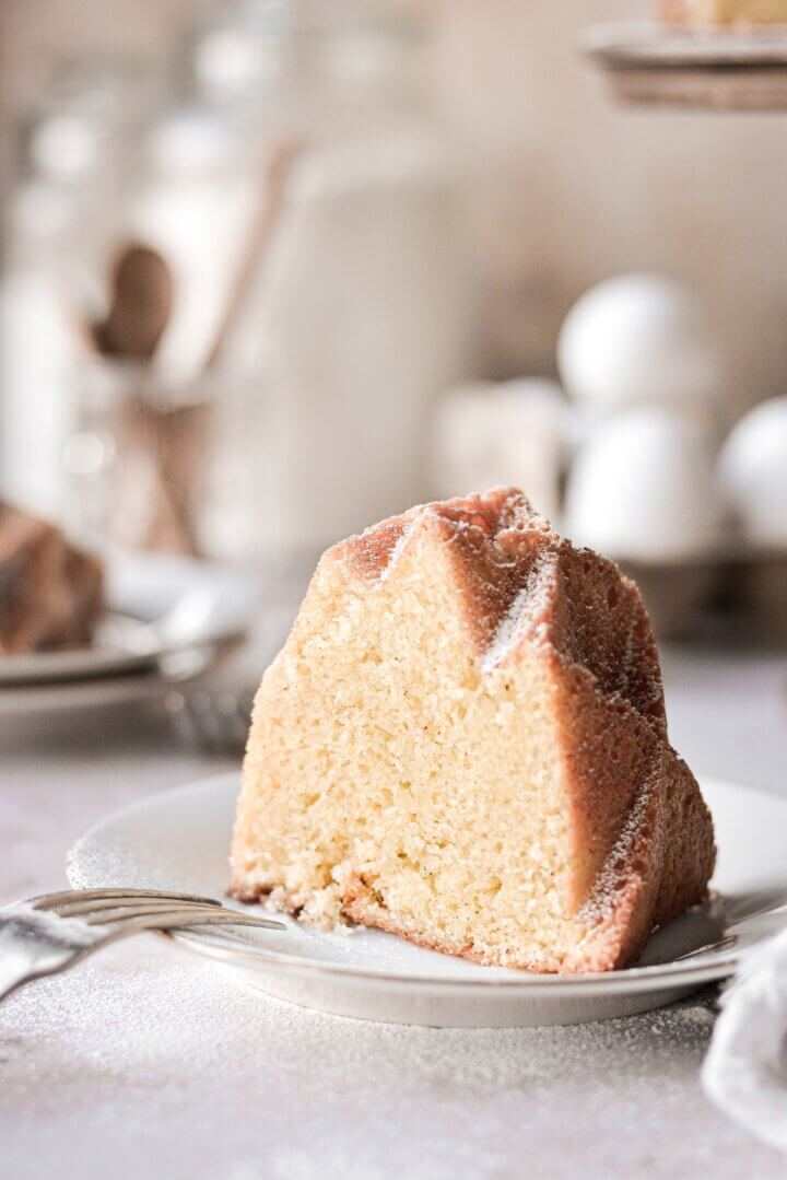 A slice of cream cheese pound cake on a plate.