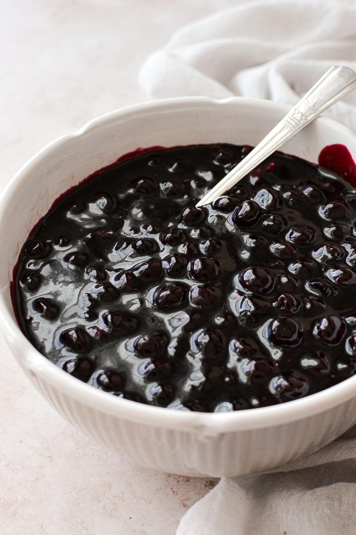 Blueberry pie filling in a bowl.