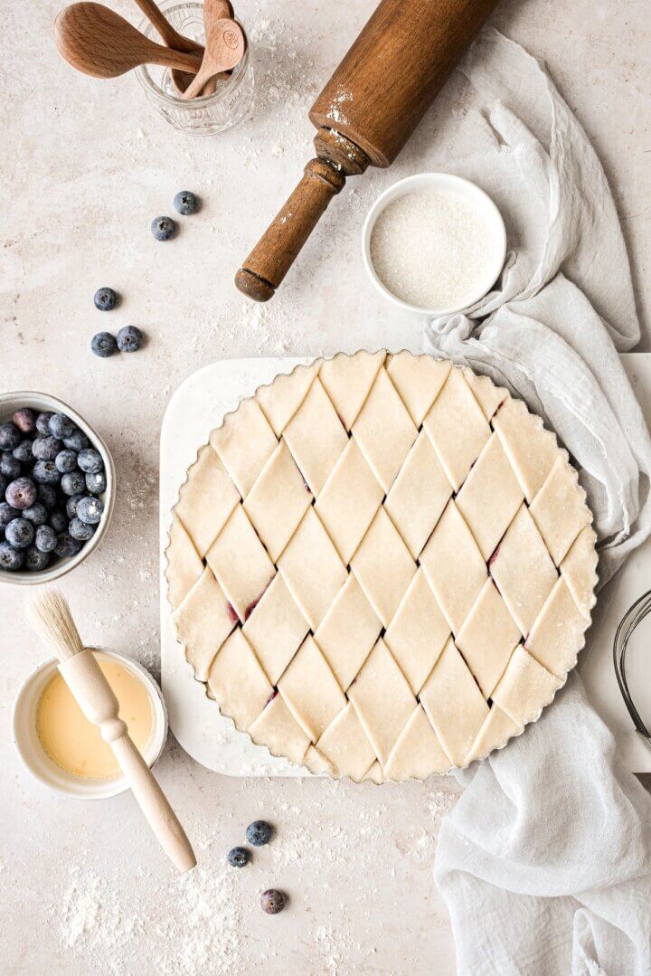Blueberry pie with a lattice crust, ready to be baked.