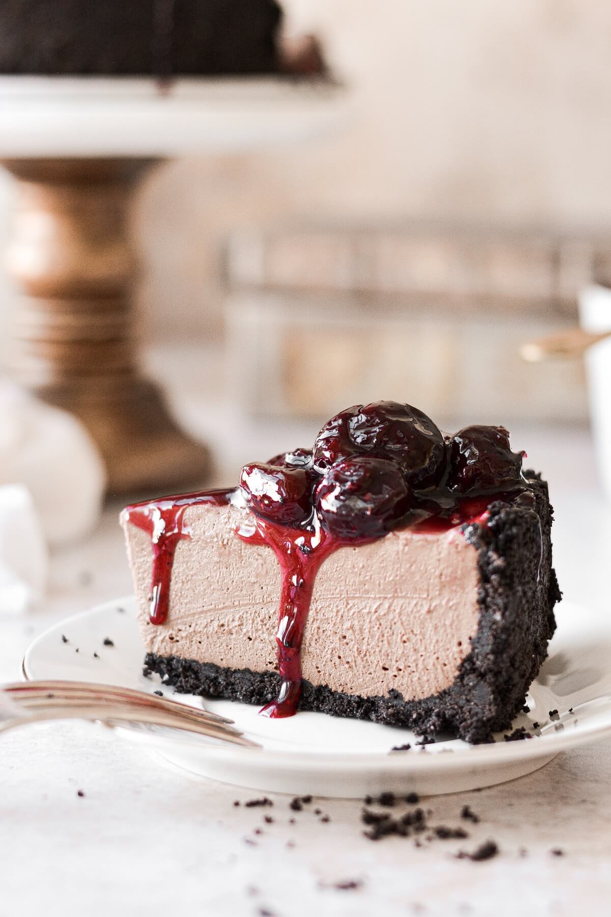 A slice of chocolate cherry cheesecake.