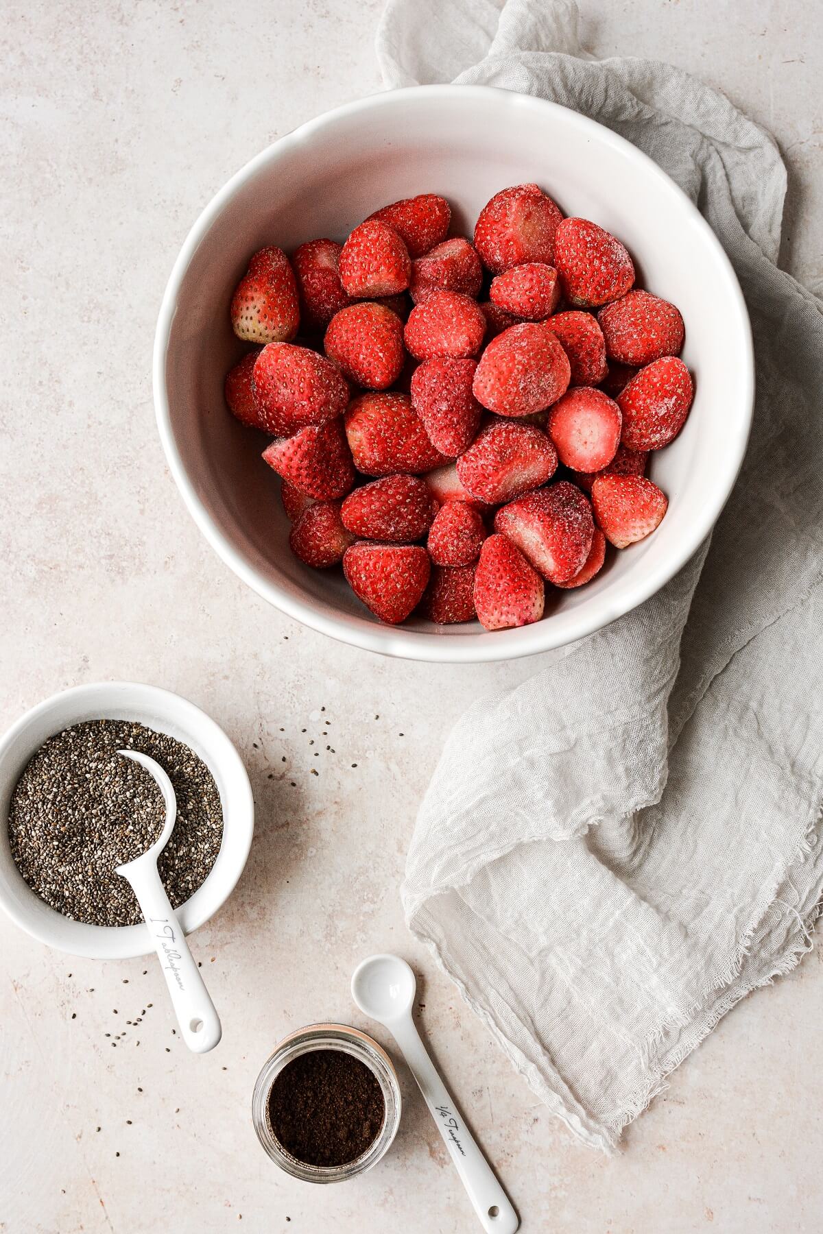 Ingredients for making strawberry chia seed jam.