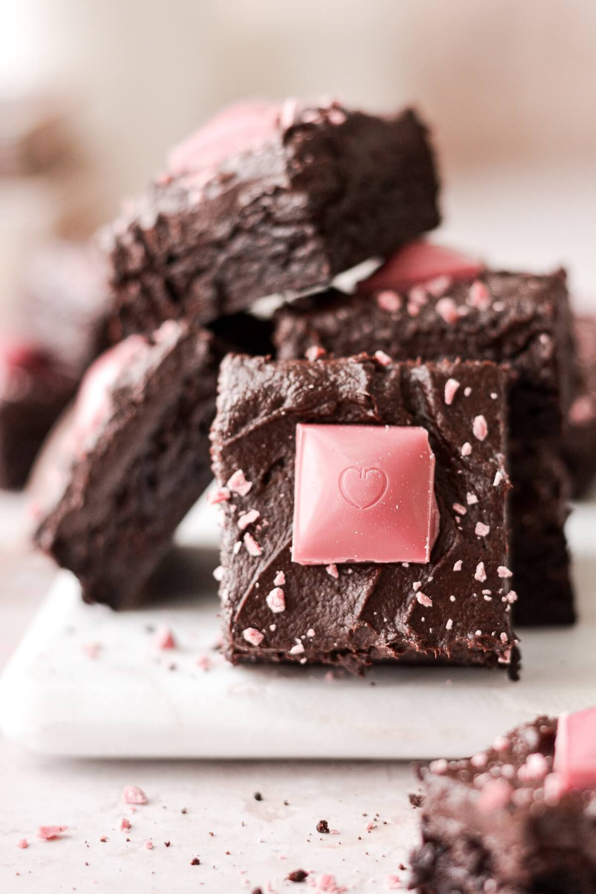 Squares of ruby chocolate on valentines fudge brownies.