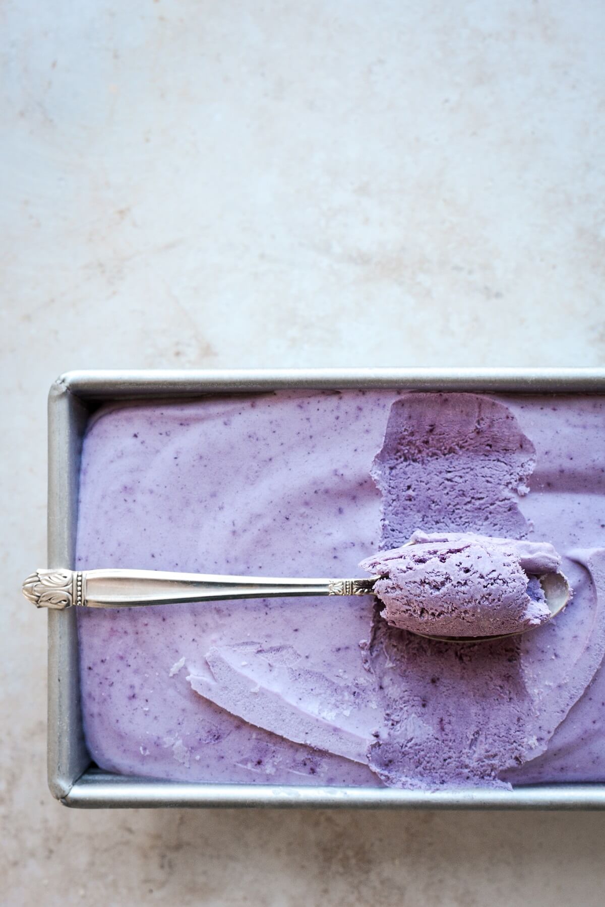 A spoonful of blueberry ice cream.