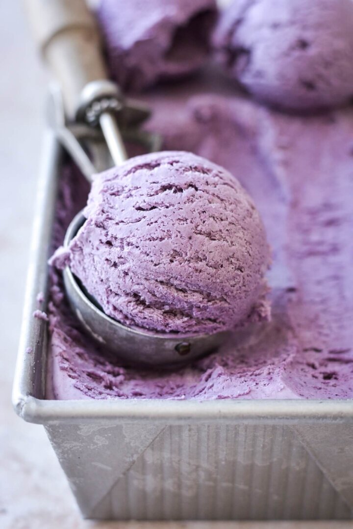 Blueberry ice cream in a vintage scooper.