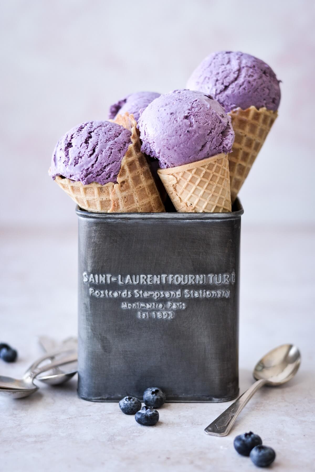 Blueberry ice cream cones in a metal box.