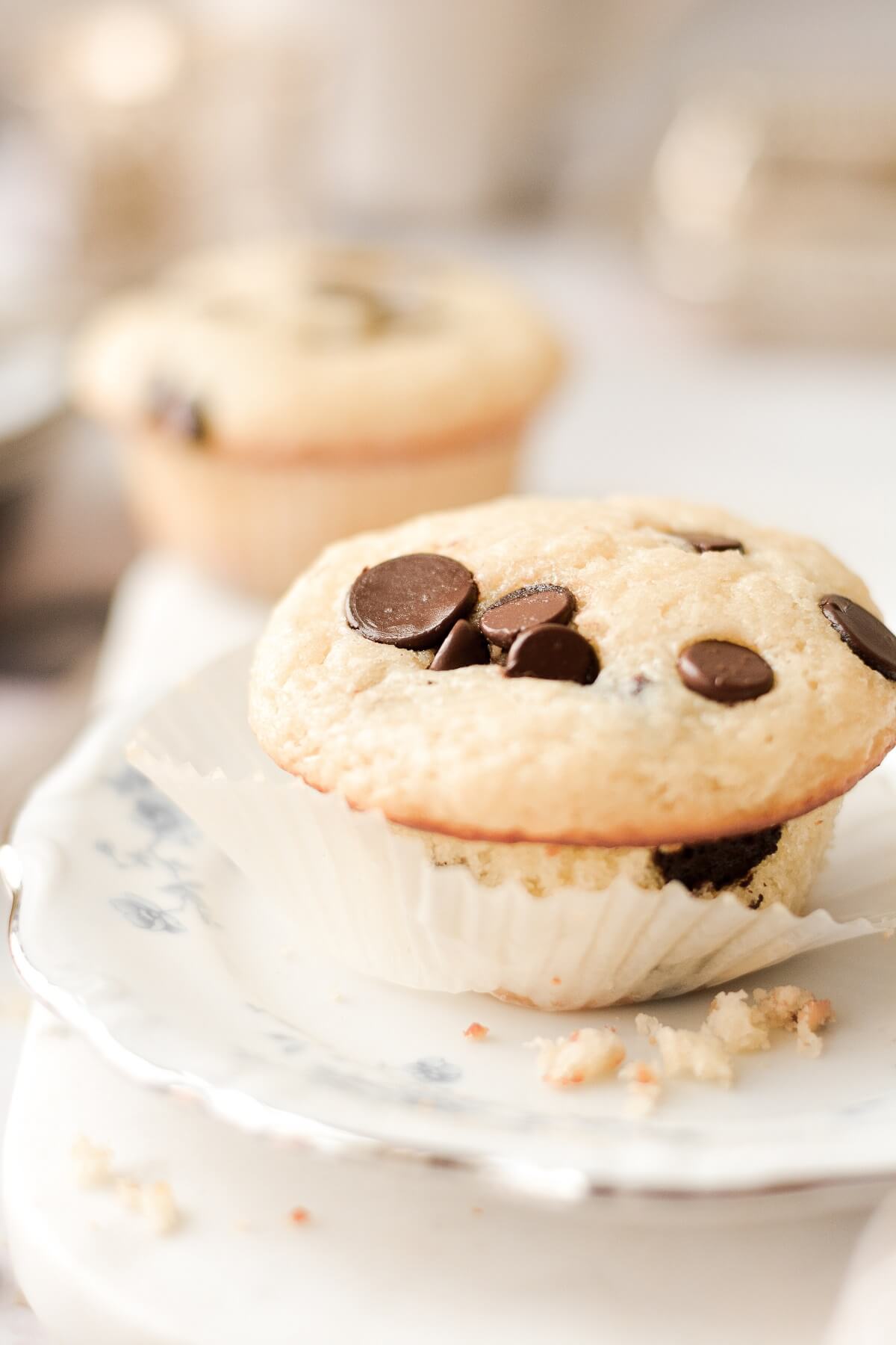 A chocolate chip buttermilk muffin with the wrapper pulled back.