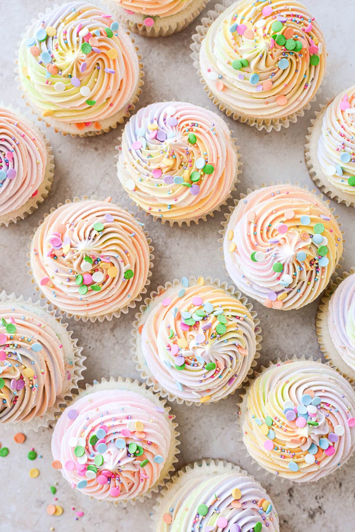 Funfetti cupcakes topped with rainbow sprinkles.