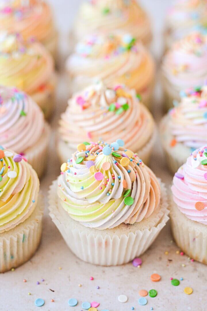 Funfetti cupcakes with rainbow swirl buttercream and sprinkles.