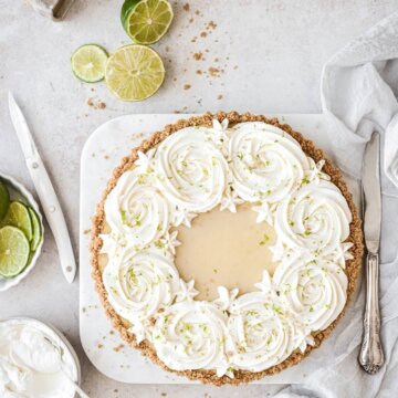 Key lime pie with whipped cream rosettes.