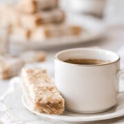 Almond crumb bars with a cup of coffee.