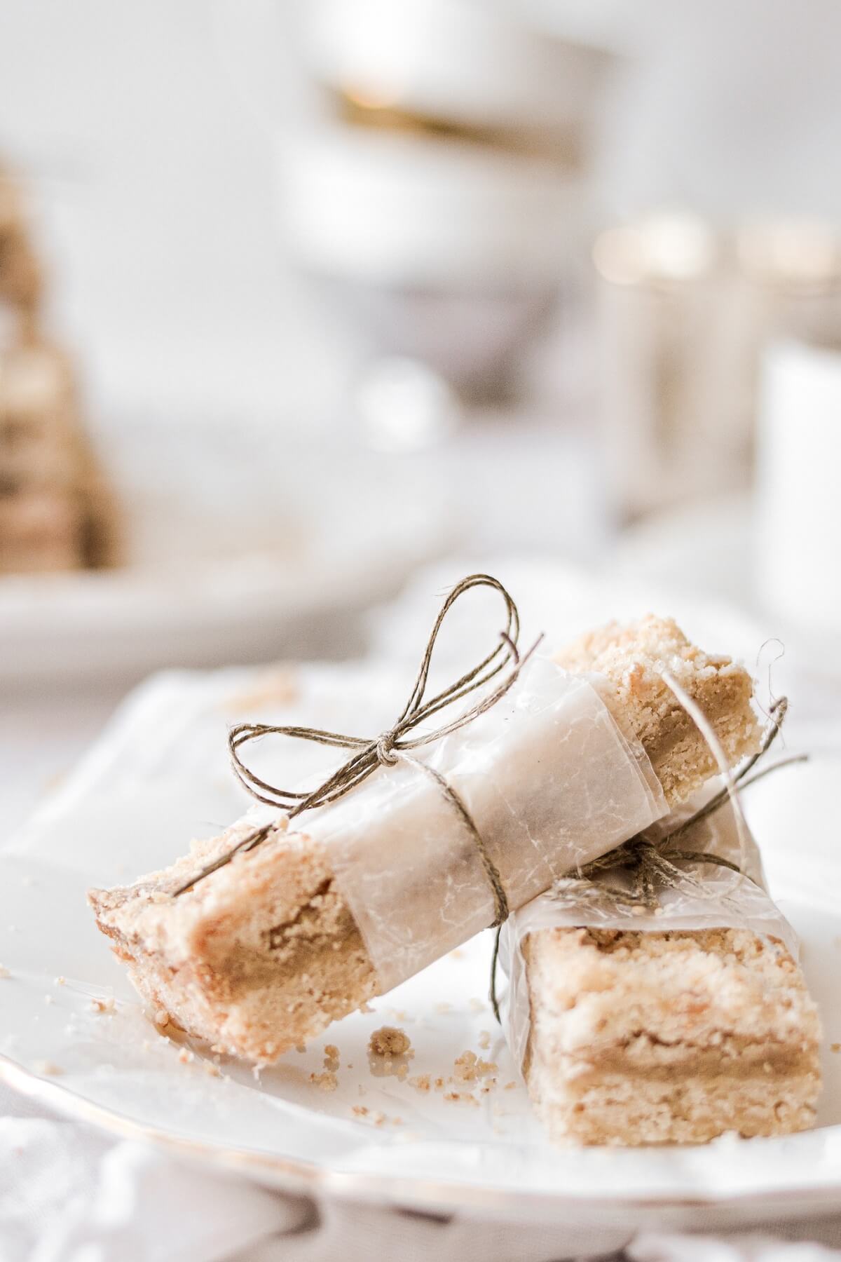 Almond crumb bars wrapped in wax paper and twine.