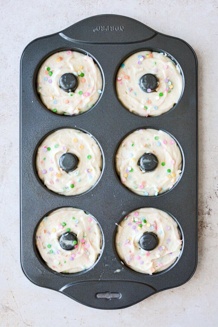 Funfetti cake batter in a doughnut pan.