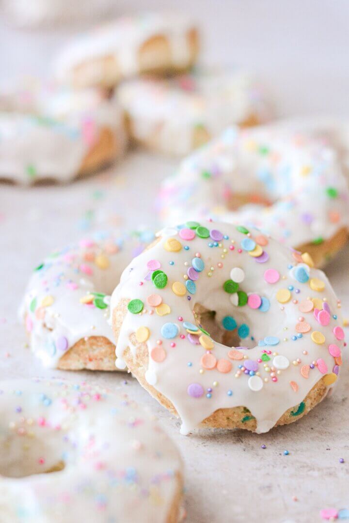 Funfetti cake doughnut with icing and sprinkles.