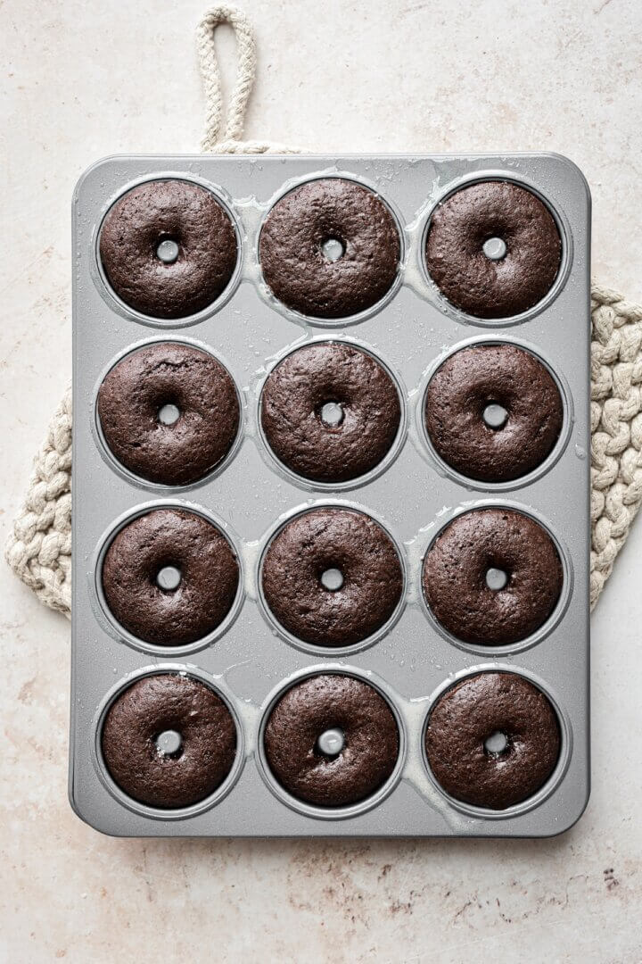 Chocolate cake doughnuts baked in a mini doughnut pan.