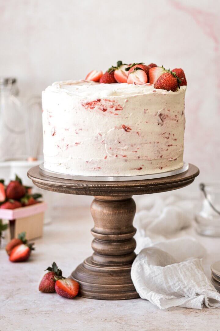 Strawberry shortcake cake topped with strawberries.