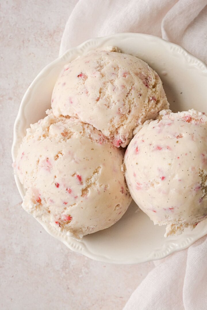Scoops of strawberry vanilla bean ice cream.