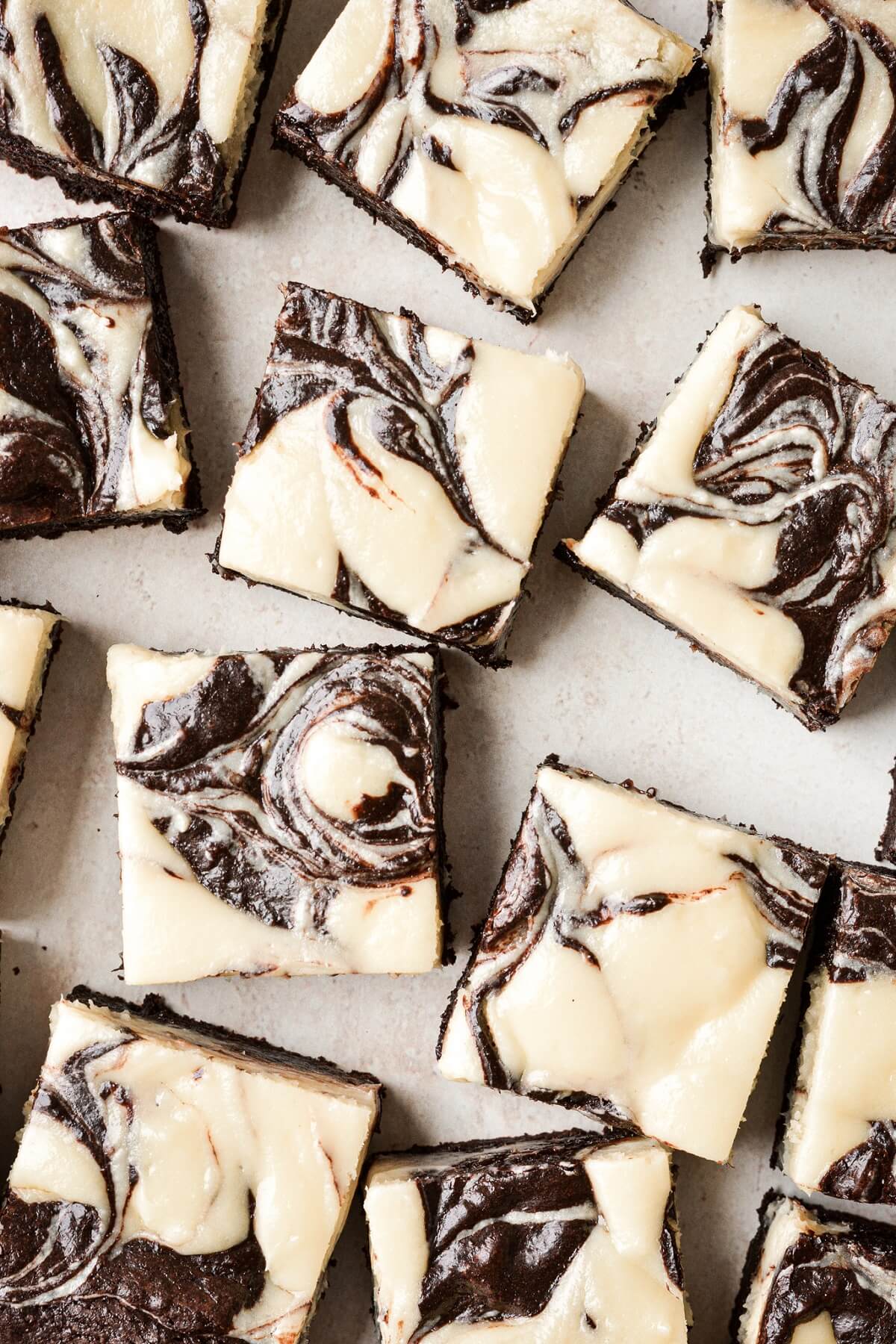 Cream cheese swirl brownies cut into squares.