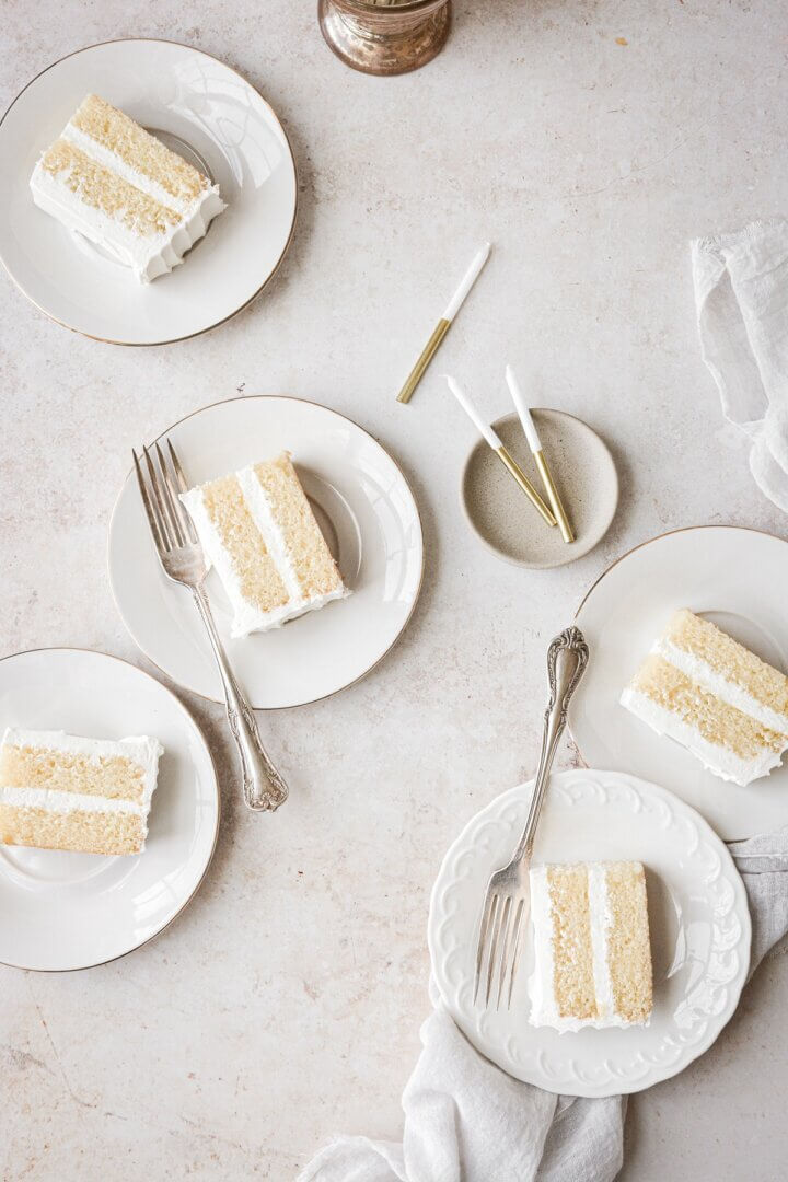 Slices of vanilla cake on plates.