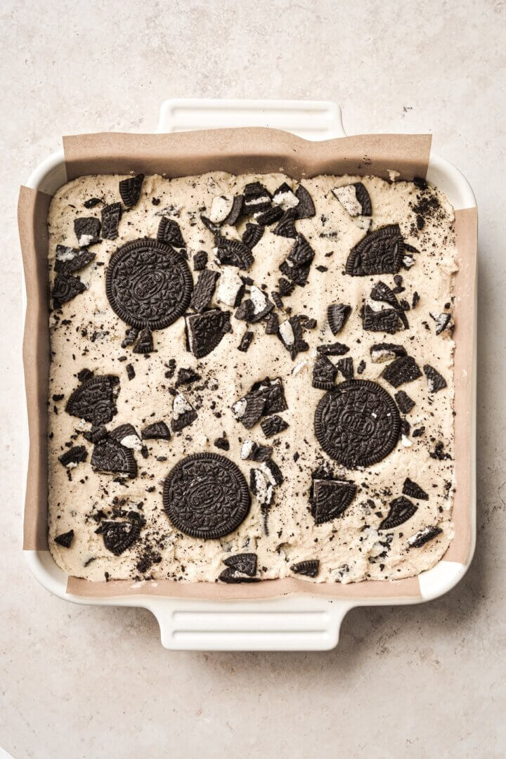 Cookies and cream Oreo blondie batter in a baking pan.