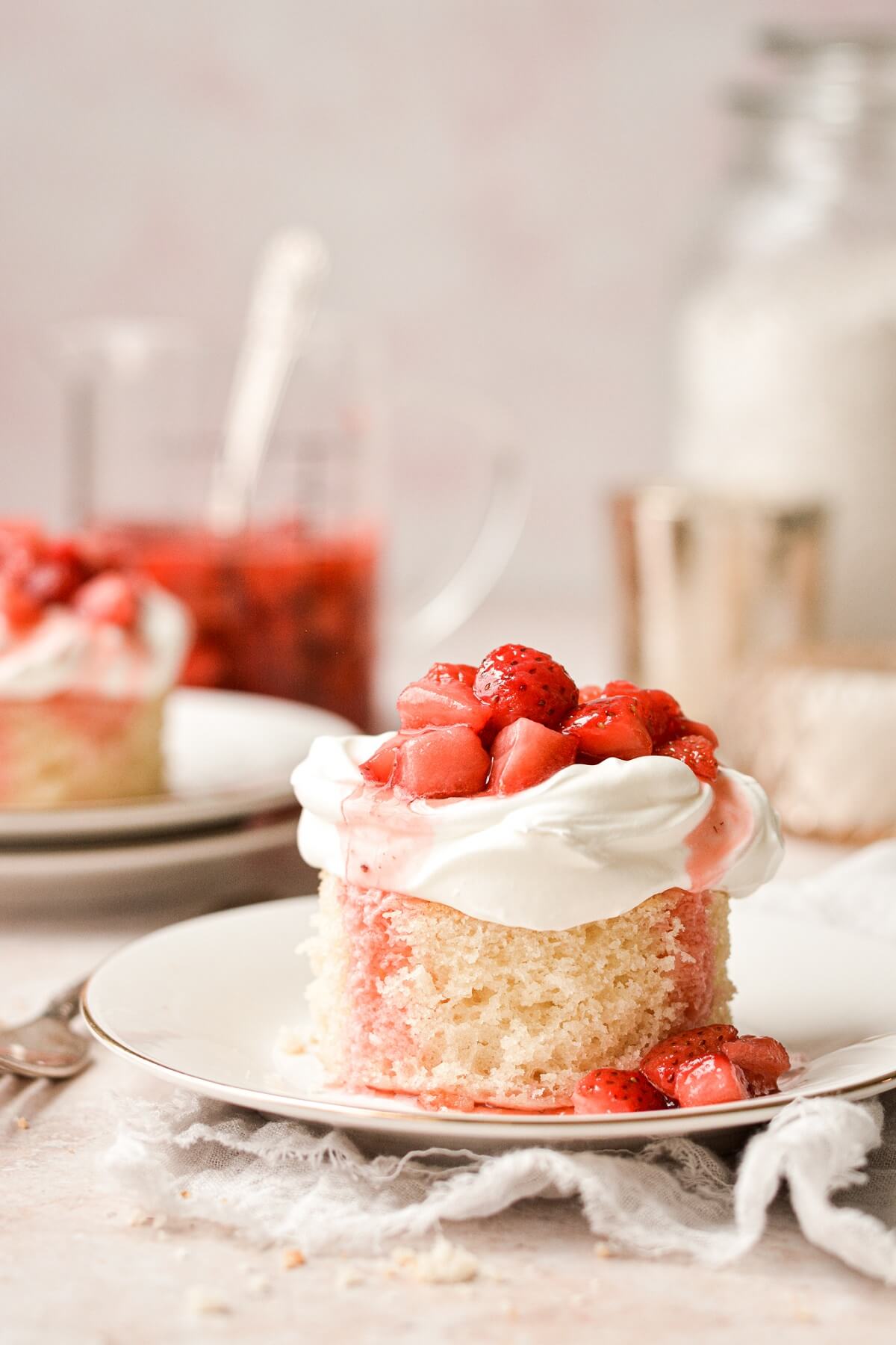 Mini strawberry shortcakes with whipped cream and strawberries.