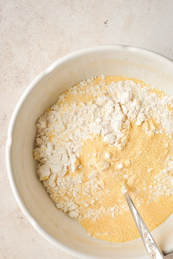 Step 3 of making cornbread muffin batter.