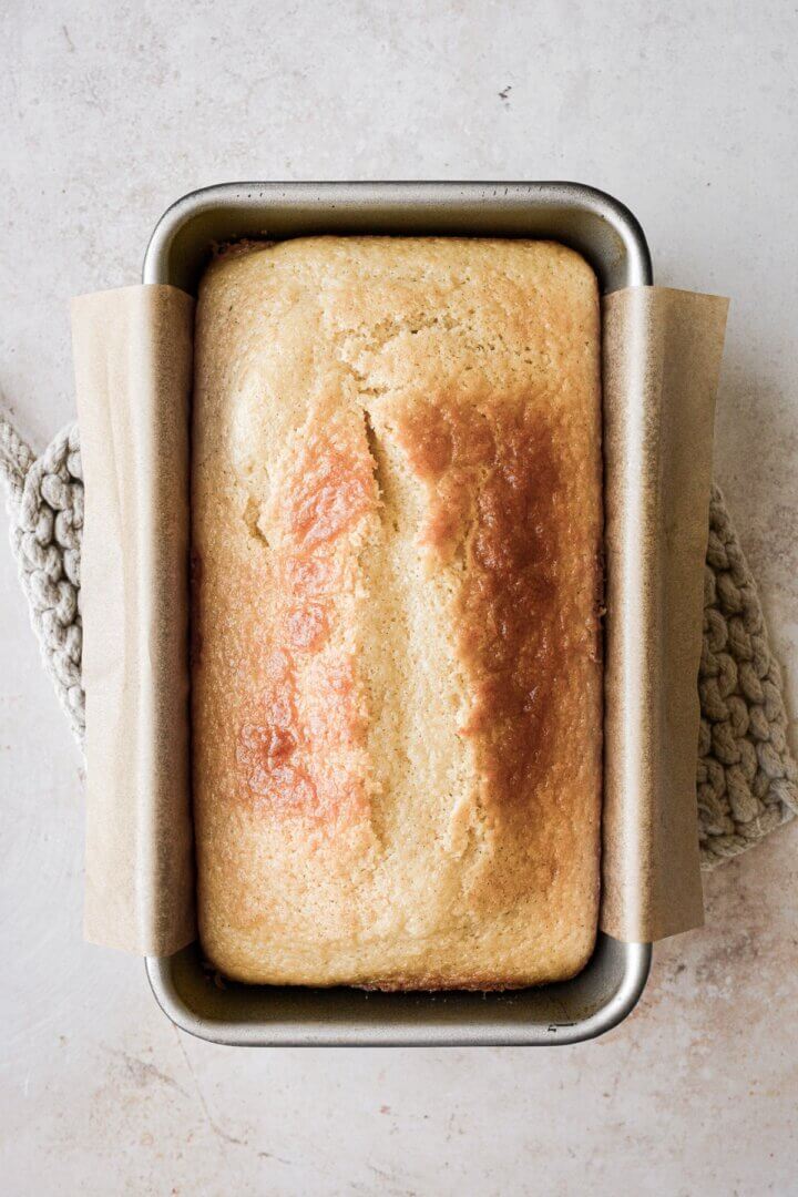 Vanilla loaf cake in a loaf pan.