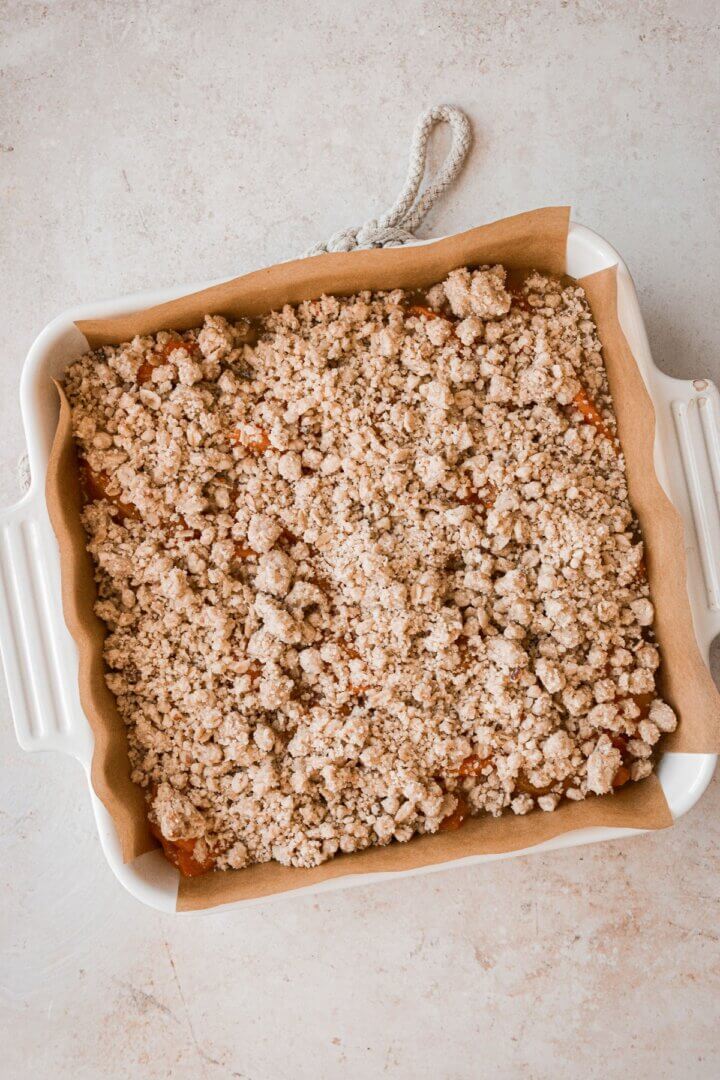 Almond oat crumble sprinkled over apricot filling.