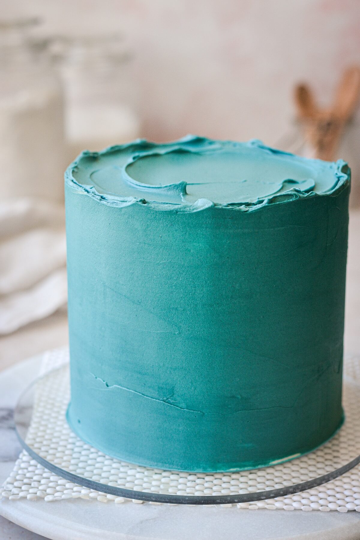 Cake frosted with deep turquoise blue buttercream.