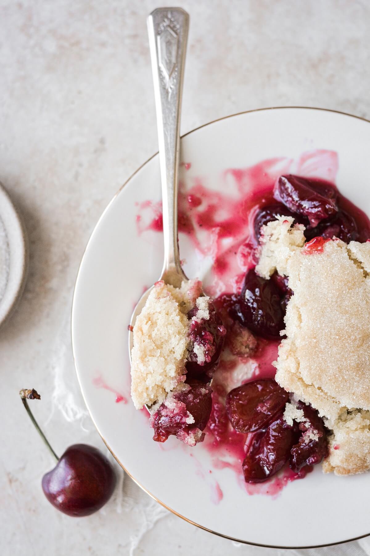 A spoonful of cherry cobbler.