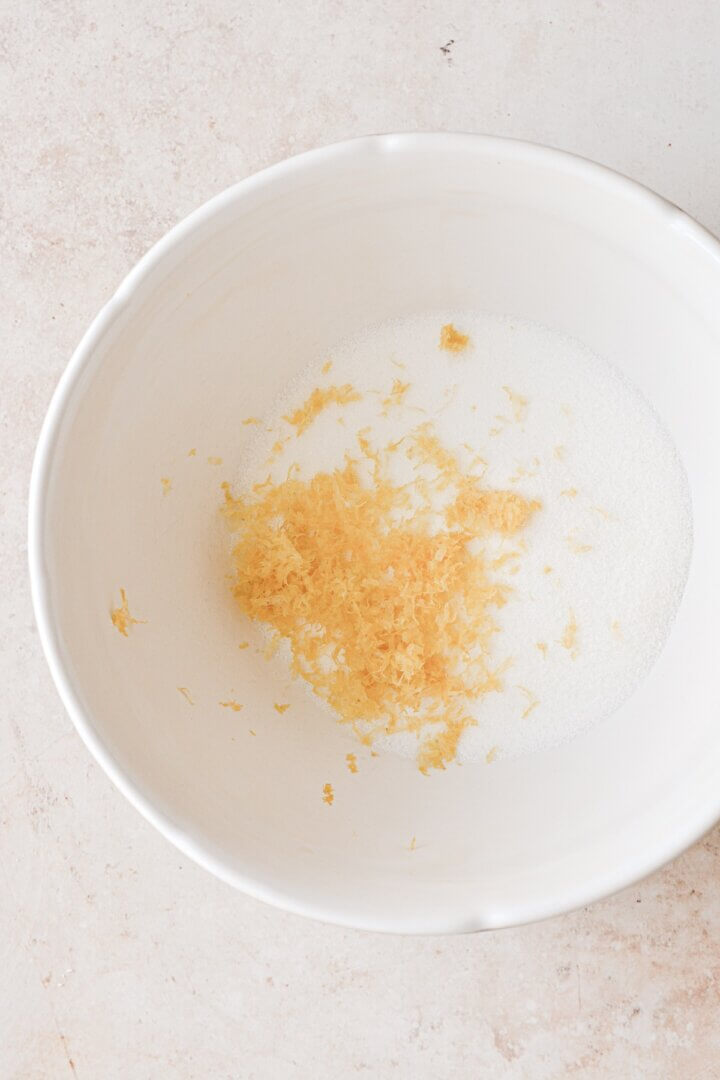 Lemon zest and sugar in a bowl.