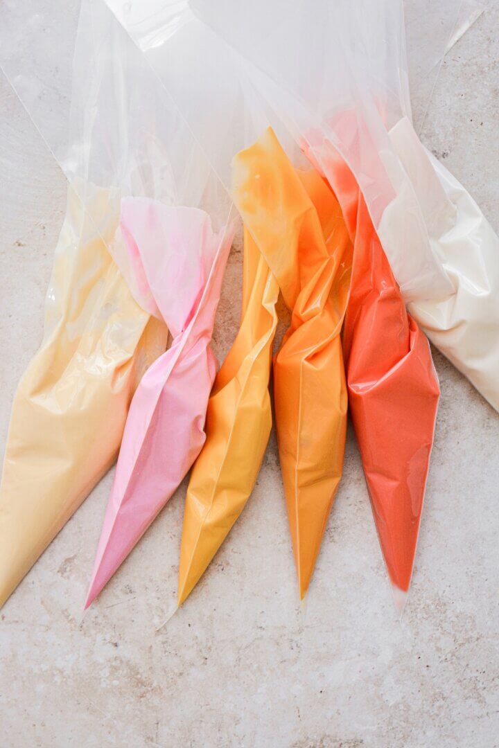 Piping bags with melted candy melts inside.