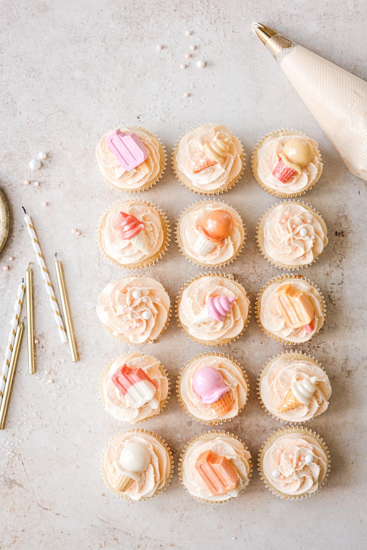 Orange creamsicle cupcakes with ice cream cone cupcake toppers.