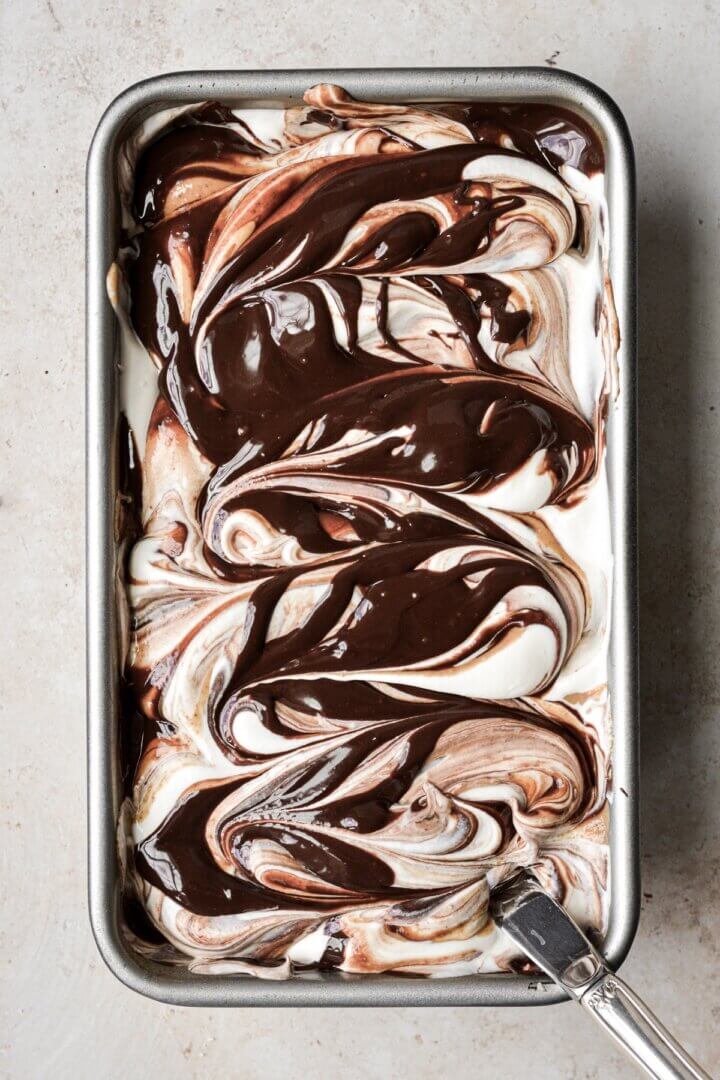 Step 6 for making no churn peanut butter vanilla fudge ripple ice cream.