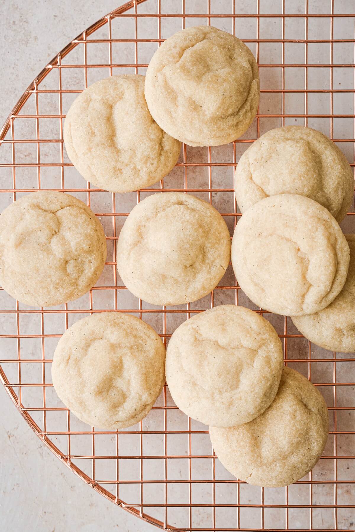 Soft sugar cookies on a cooling rack.