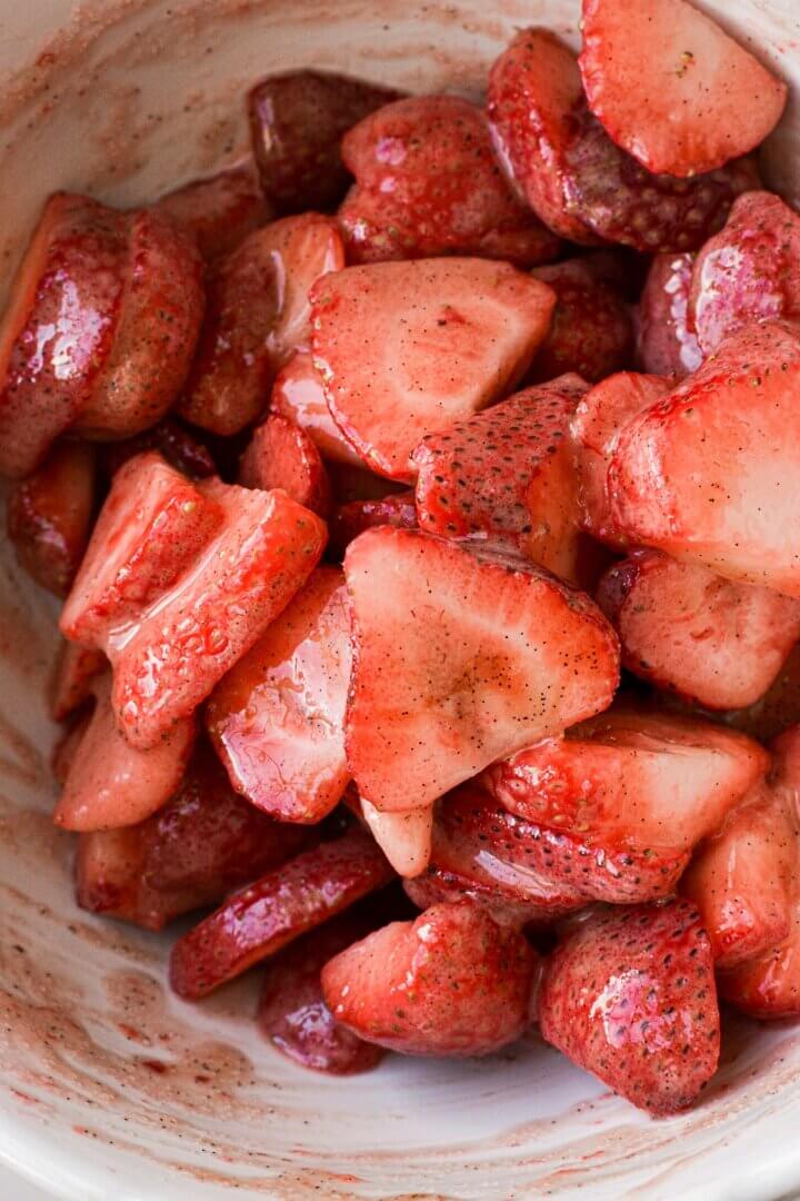 Sliced strawberies with sugar and vanilla bean paste.
