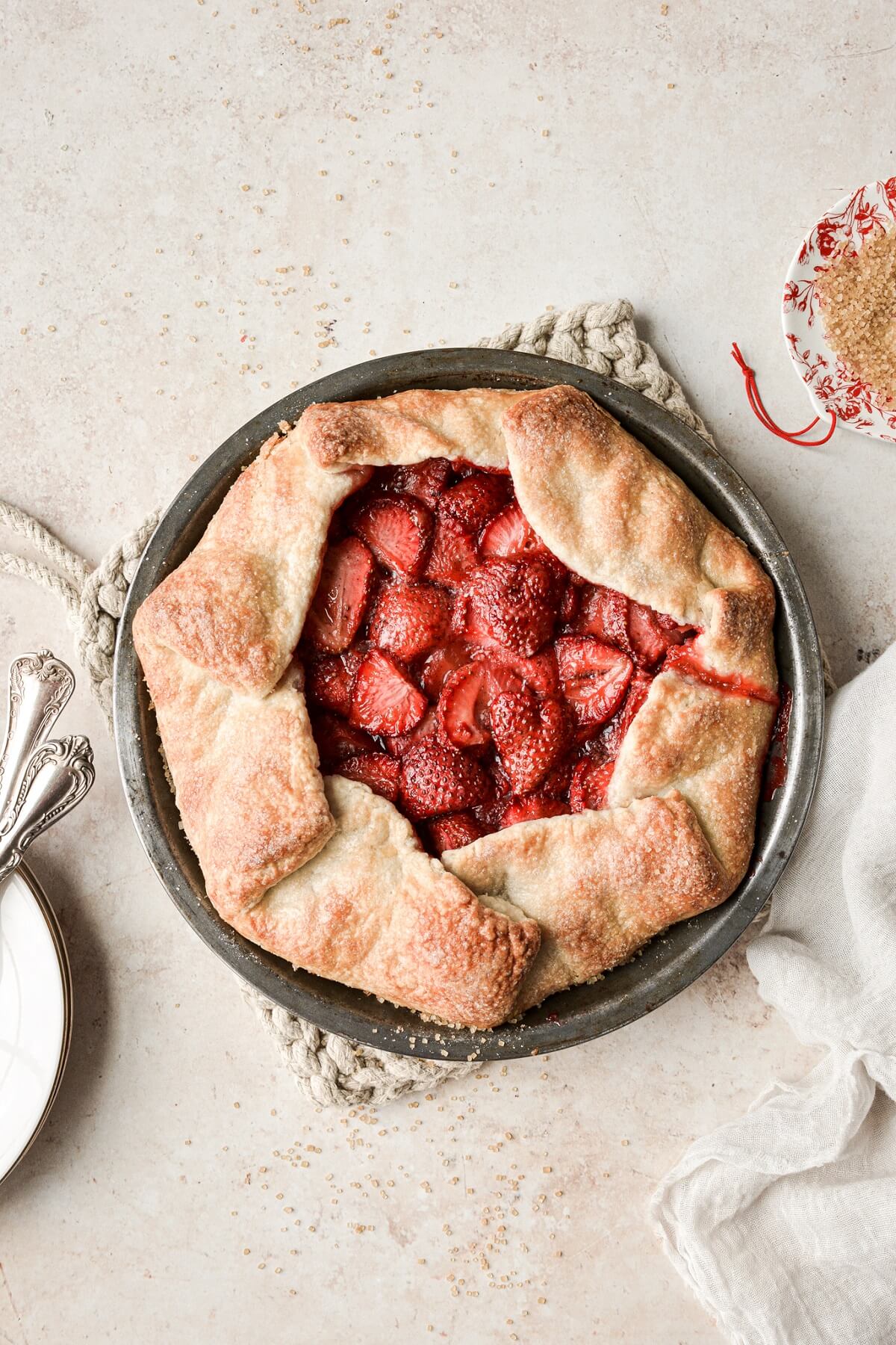Strawberry galette sprinkled with sugar.