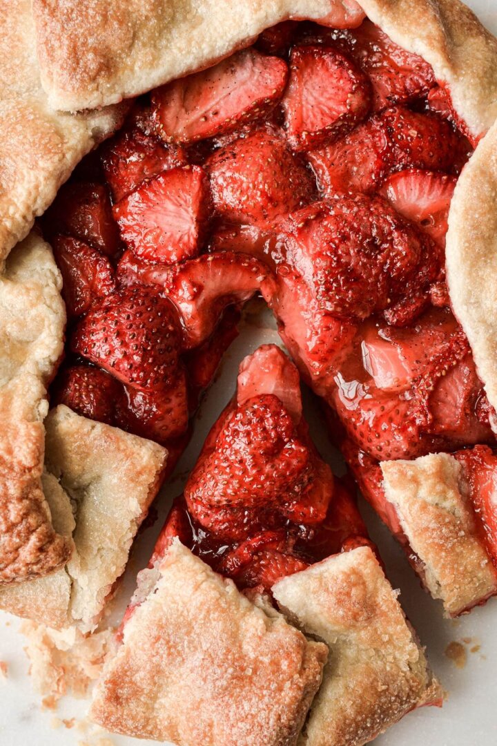 Strawberry galette with one slice cut.