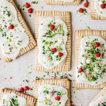 Homemade strawberry pop tarts with icing and sprinkles.