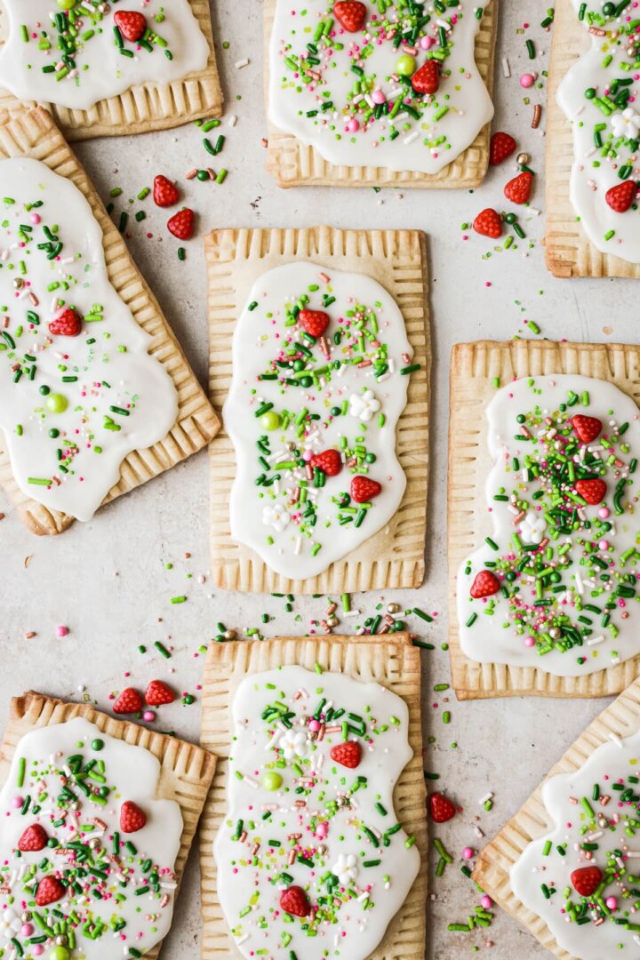 Homemade strawberry pop tarts with icing and sprinkles.