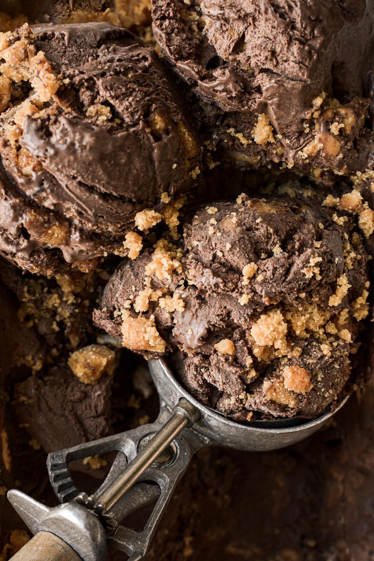 Scoops of no churn chocolate peanut butter cookie ice cream.