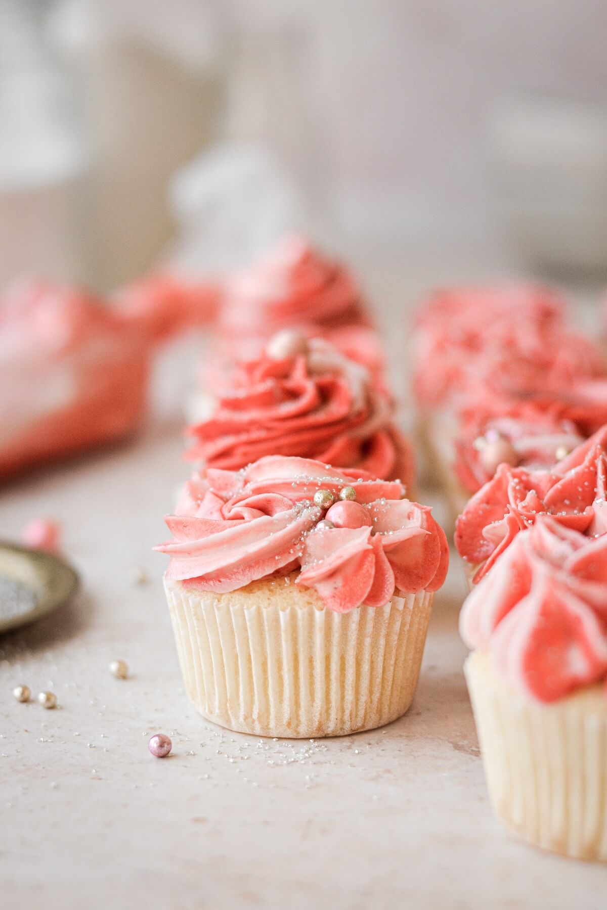 Pink frosted cupcakes.