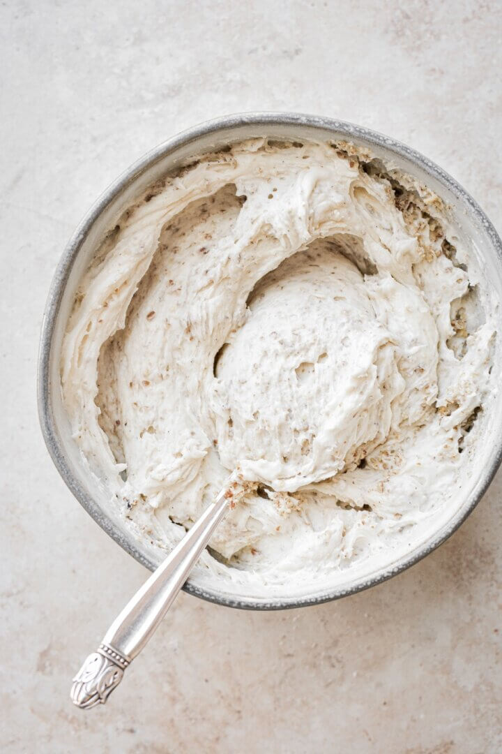 Bowl of pecan cream cheese buttercream frosting.