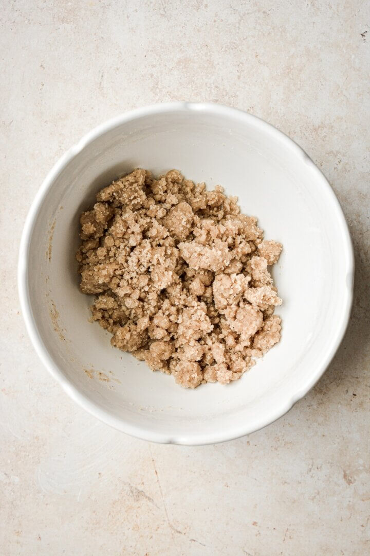 Bowl of crumb topping for pumpkin bread.