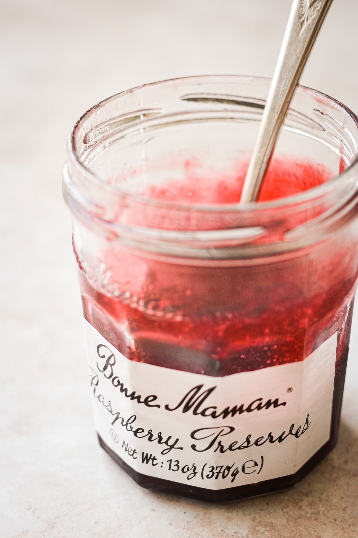 Jar of raspberry preserves.
