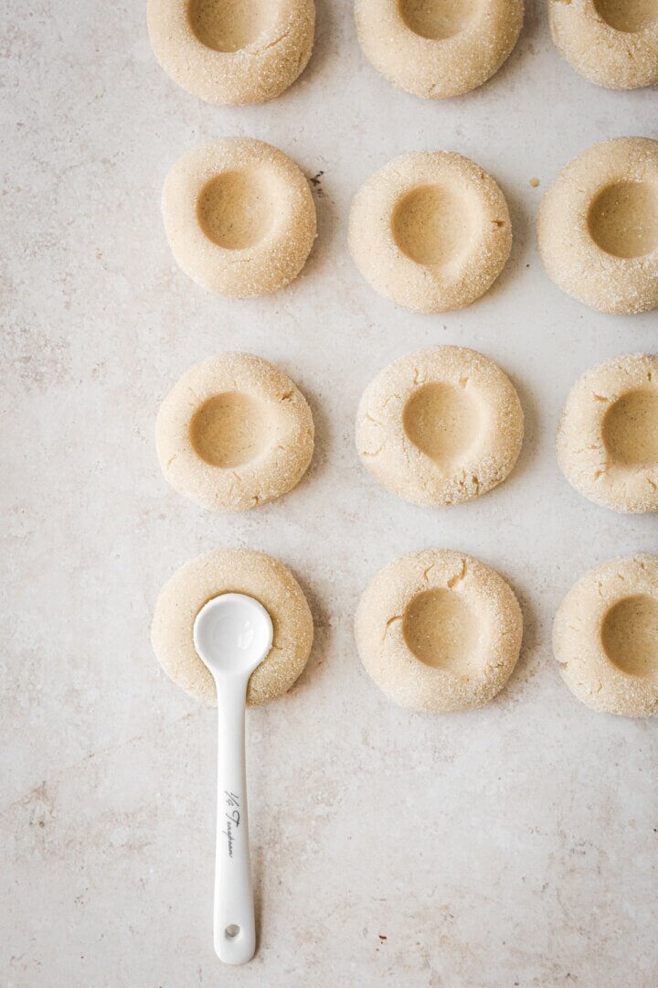Step 7 for making raspberry thumbprint sugar cookies.