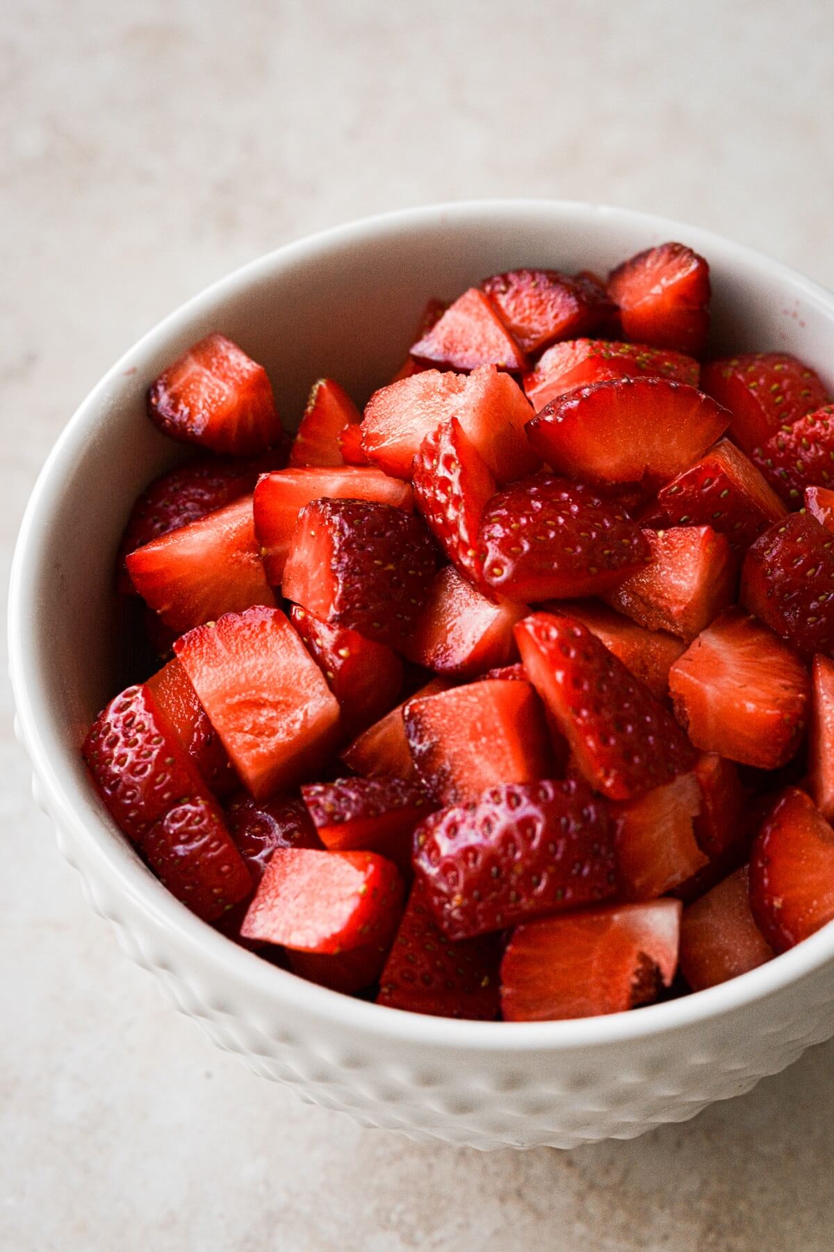 Bowl of chopped strawberries.