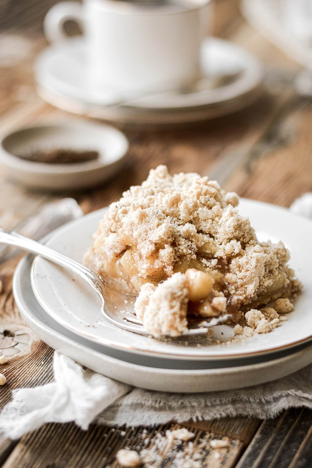 Apple crumb pie bar on a plate.