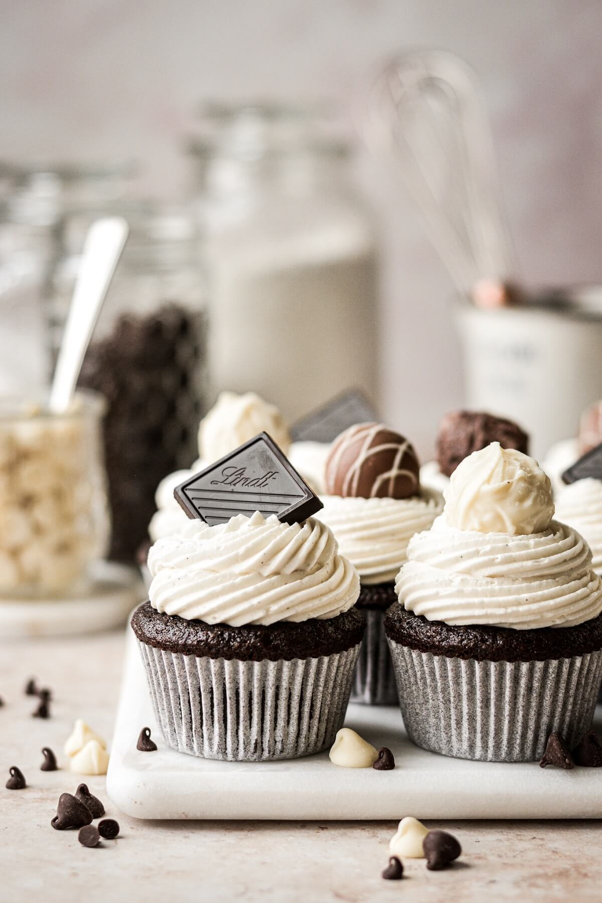 Black and white chocolate cupcakes topped with chocolate truffles.