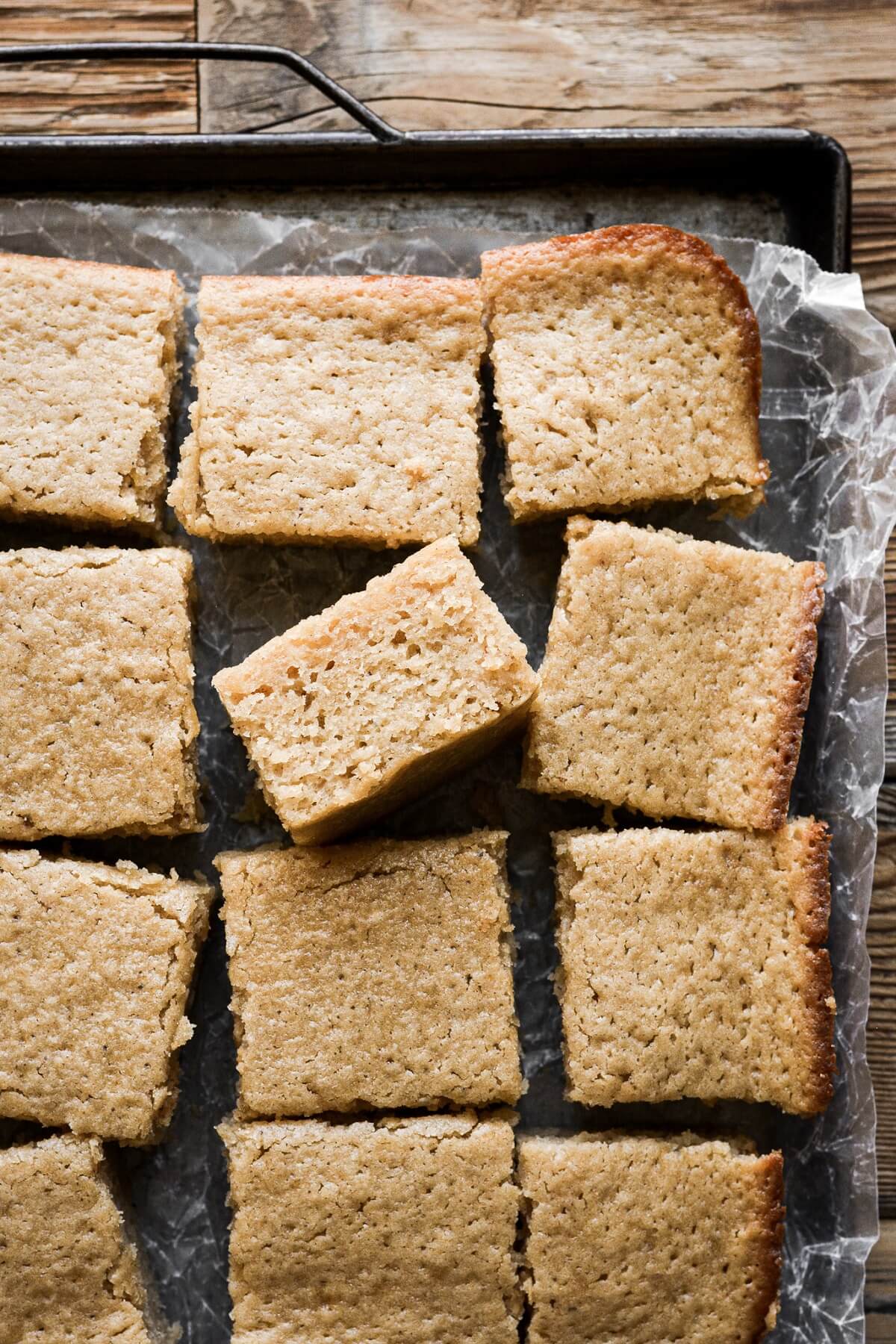 Brown butter cake cut into squares.
